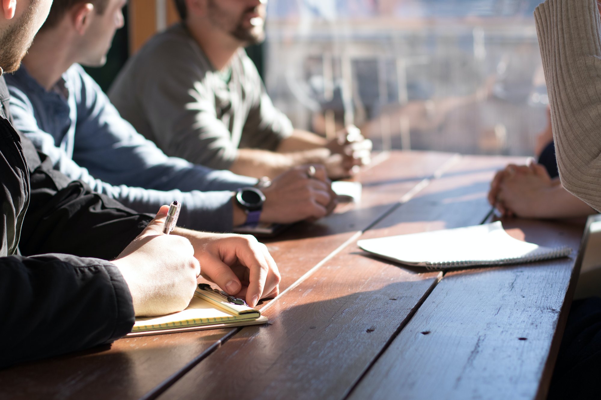 People taking notes during a training session